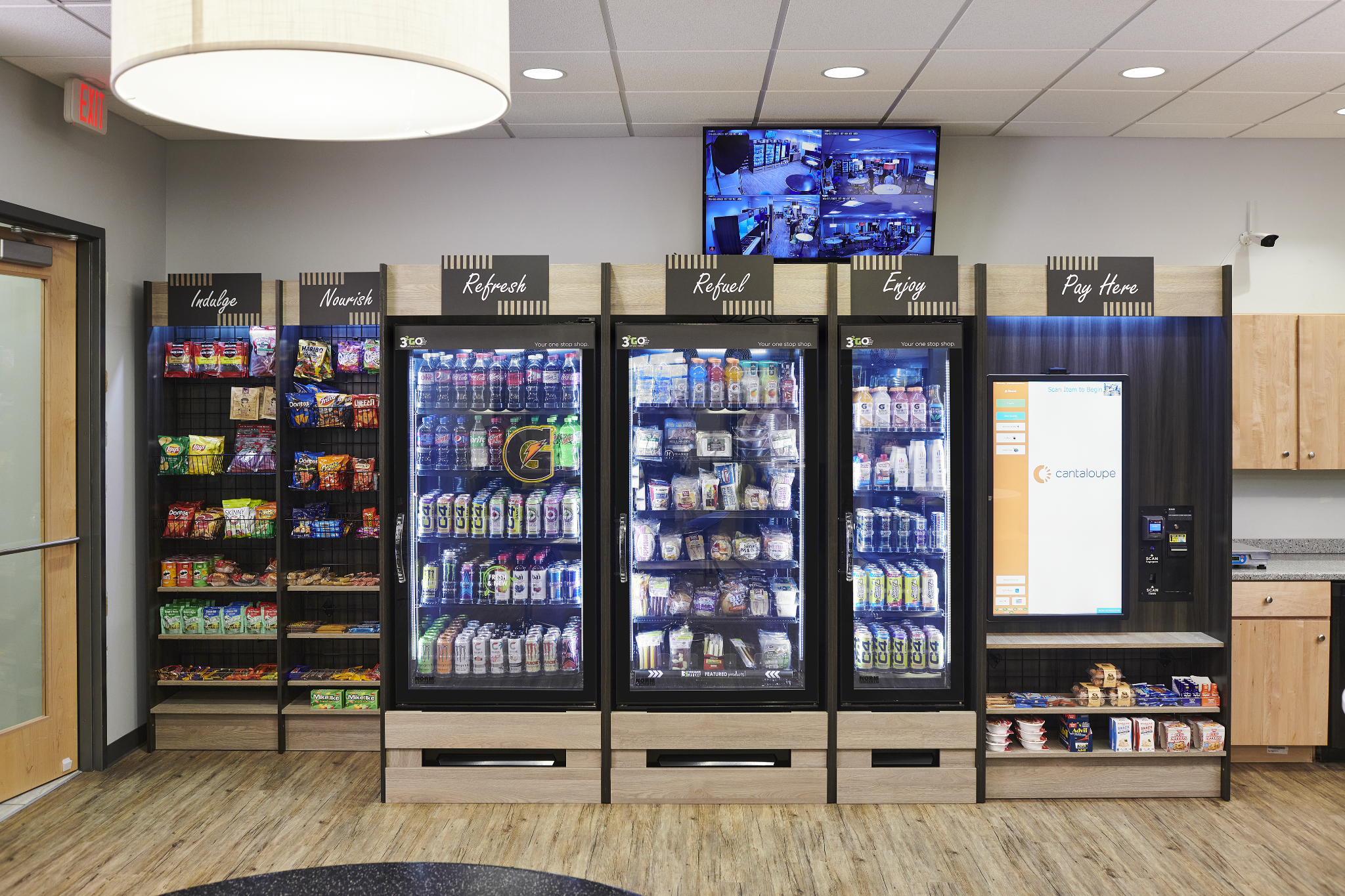 Modern micro market with refrigerated cases, shelves, and self-checkout